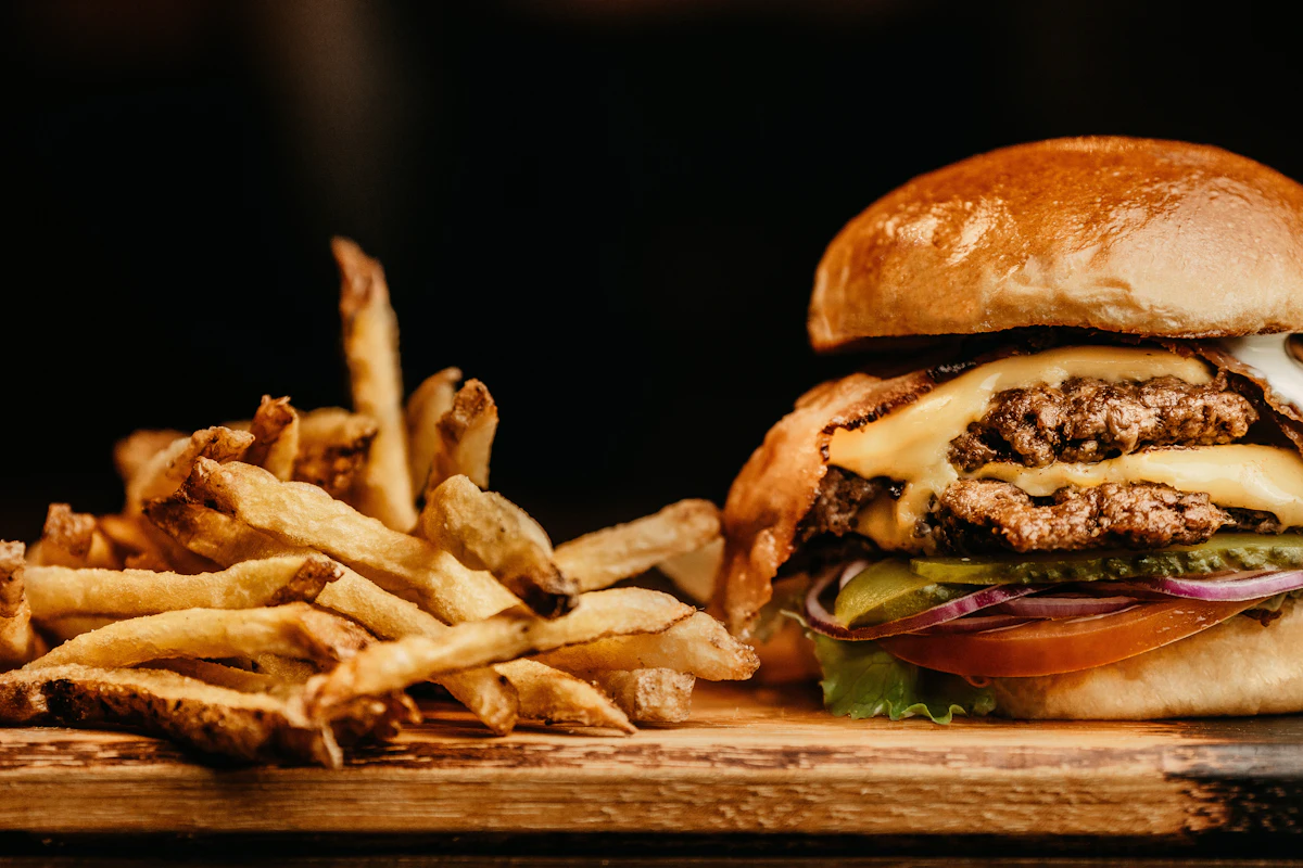 The OG Byte — single smash cheeseburger in moody light